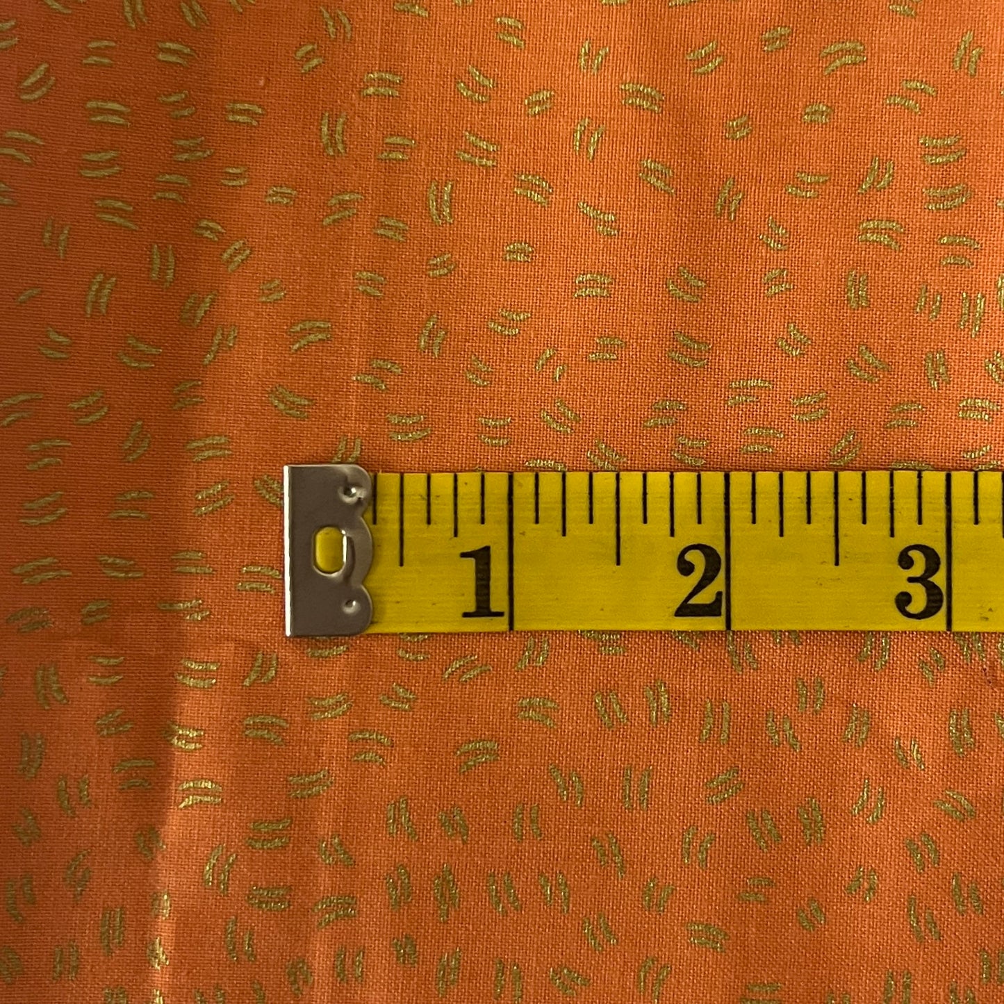 Orange With Gold Hash Marks Cotton: 1 yd
