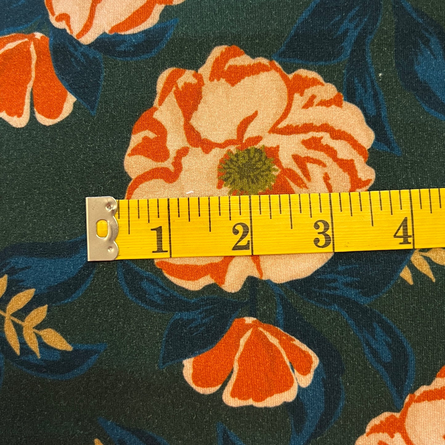 Green With Orange Floral Stretch Jersey: 1.5 yds