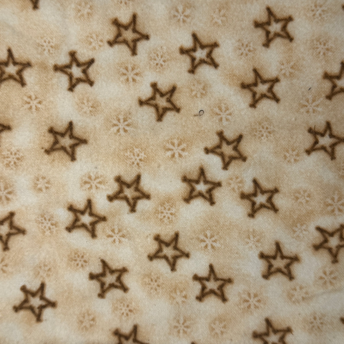 Cream With Brown Stars Flannel: 1.25 yds