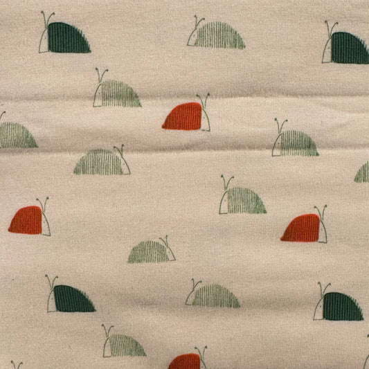Cream With Red & Green Snails Stretch Jersey: 4 yds
